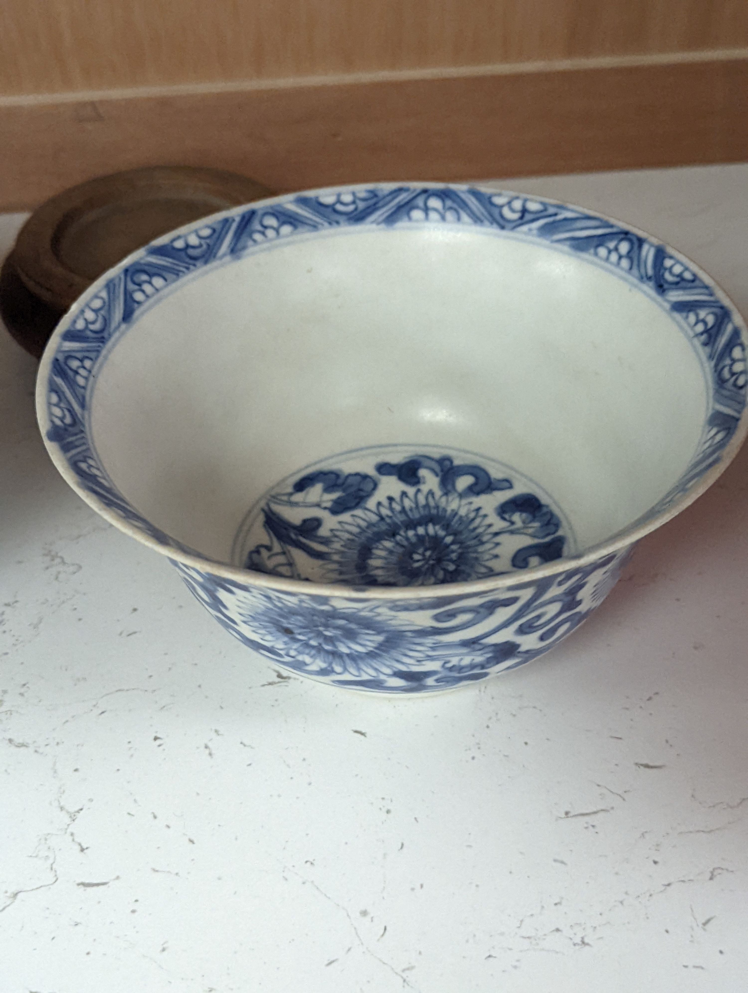 A Chinese blue and white bowl, Kangxi, 15cm. diam., a famille rose teapot stand, Yongzheng, and two doucai bowls